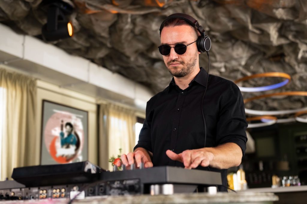 dj picking the right music to fit the event